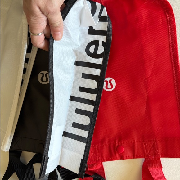 Lululemon shopping bags. Red, Black, and White Tote Bags - Picture 4 of 5